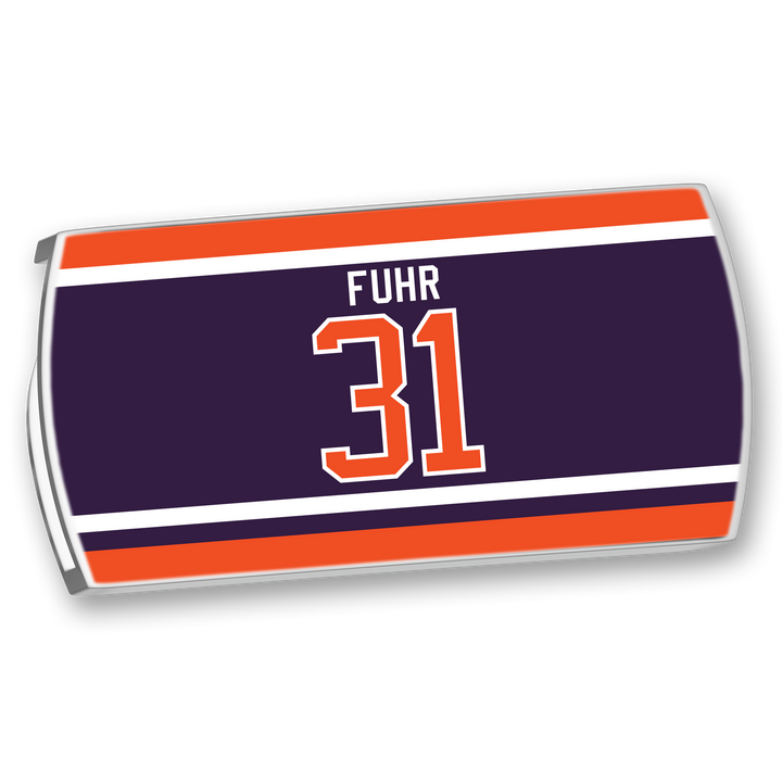 The ZippyBack™ Grant Fuhr hockey jersey nameplate features "FUHR" and number 31 in white and orange on navy, bordered by orange and white stripes—a tribute to the legendary goalie's composure and reflexes.