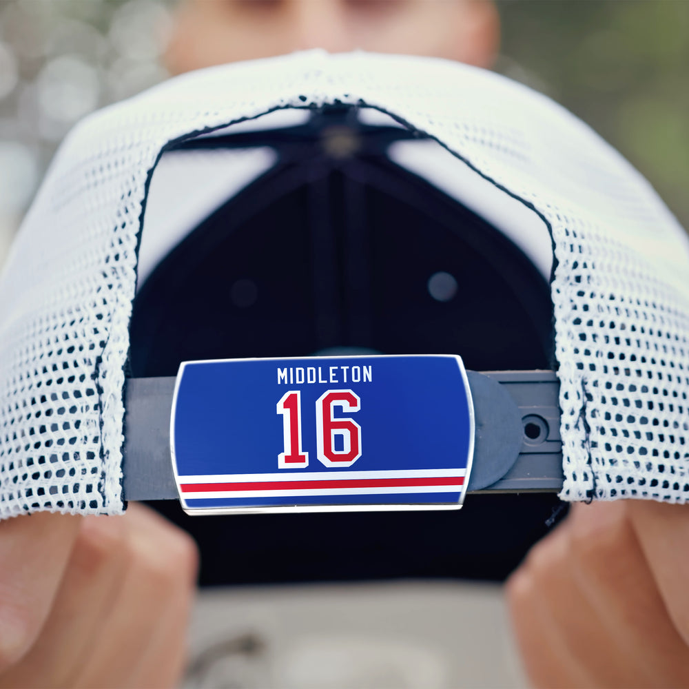 A person holds a white mesh ZippyBack™ cap worn backwards, showcasing a blue "Rick Middleton" label and the number 16—ideal for any skilled winger.