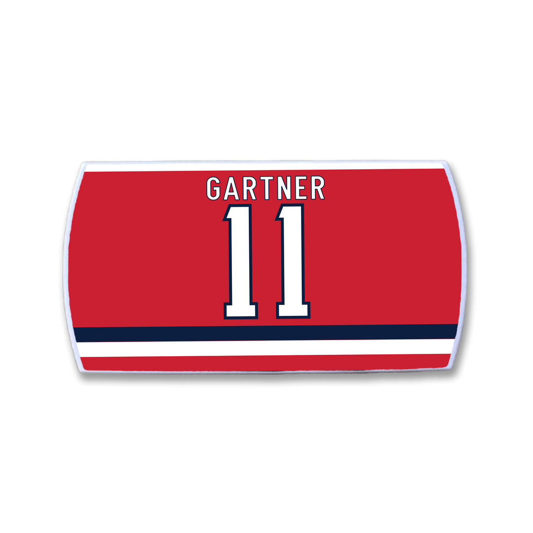 The ZippyBack™ Mike Gartner red hockey jersey nameplate features his name in white above the number 11, outlined in blue and white, plus two horizontal blue and white stripes at the bottom—honoring his renowned speed and quick release.