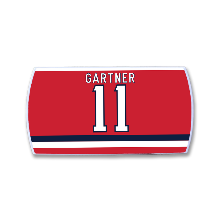 The ZippyBack™ Mike Gartner red hockey jersey nameplate features his name in white above the number 11, outlined in blue and white, plus two horizontal blue and white stripes at the bottom—honoring his renowned speed and quick release.