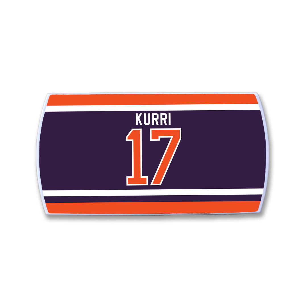 Celebrate Jari Kurri with this ZippyBack™ patch: a rectangular dark blue background with red and white stripes, showcasing “Jari Kurri” in white above his iconic orange-and-white number 17—a nod to his legendary offense.