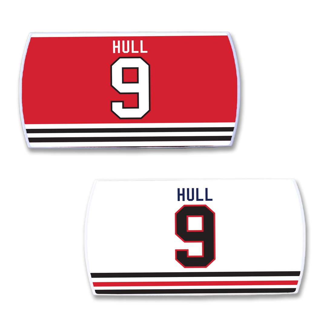Two rectangular ZippyBack™ nameplates for Bobby Hull: one red with black and white stripes, one white—both displaying “HULL” and number 9 to honor his legendary scoring legacy.