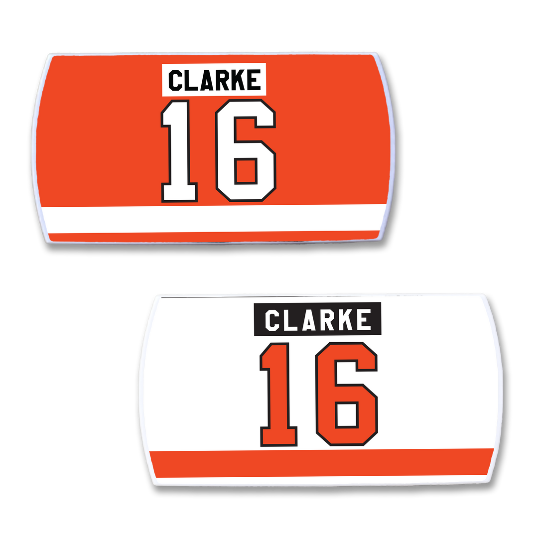 ZippyBack™ Bobby Clarke nameplates honor his elite two-way play. The set includes orange and white rectangular plates, each with CLARKE and 16 in bold black text over an orange stripe, celebrating this legendary leader.