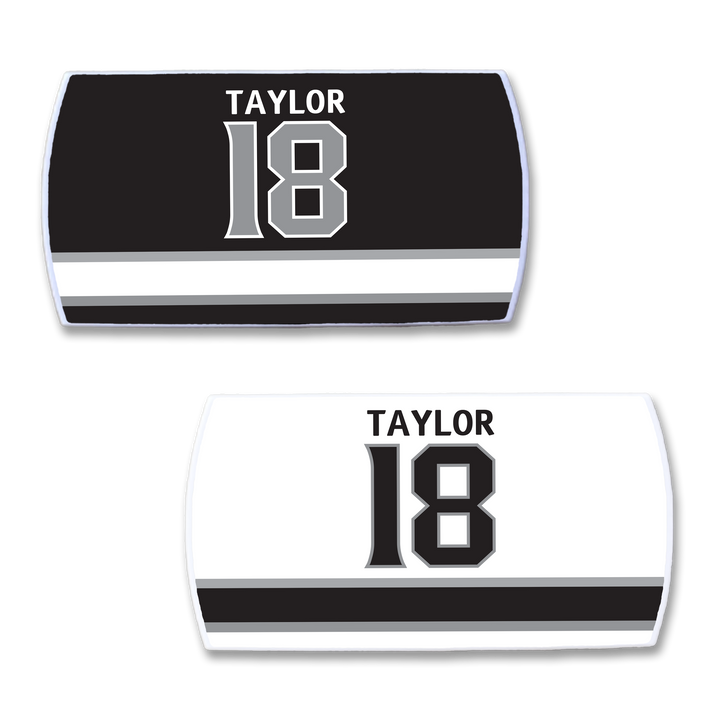 Two ZippyBack™ “Dave Taylor” sports jersey nameplates—one black, one white—feature TAYLOR and 18 above a bold black/gray stripe, honoring the reliable scoring of playmaking forward Dave Taylor.