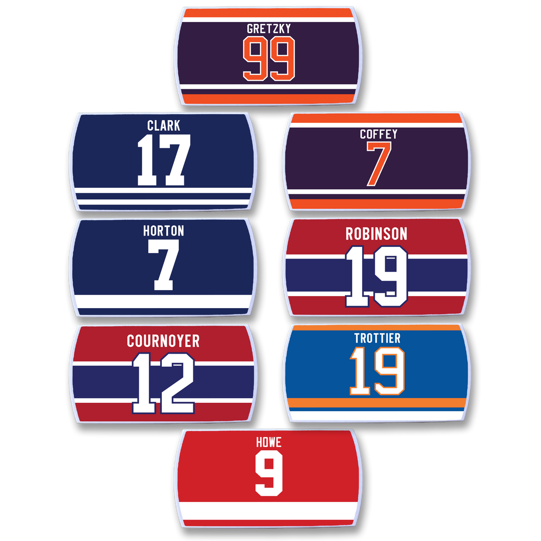 The ZippyBack™ Rafters Series 1 Set features eight illustrated hockey jersey nameplates, each with names and numbers of legendary players in iconic team colors—a limited-edition collector’s item.